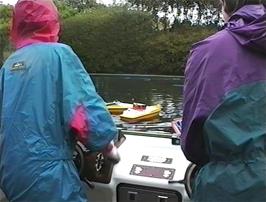 Jordan and Neil play with the radio controlled boats at Goonhavern